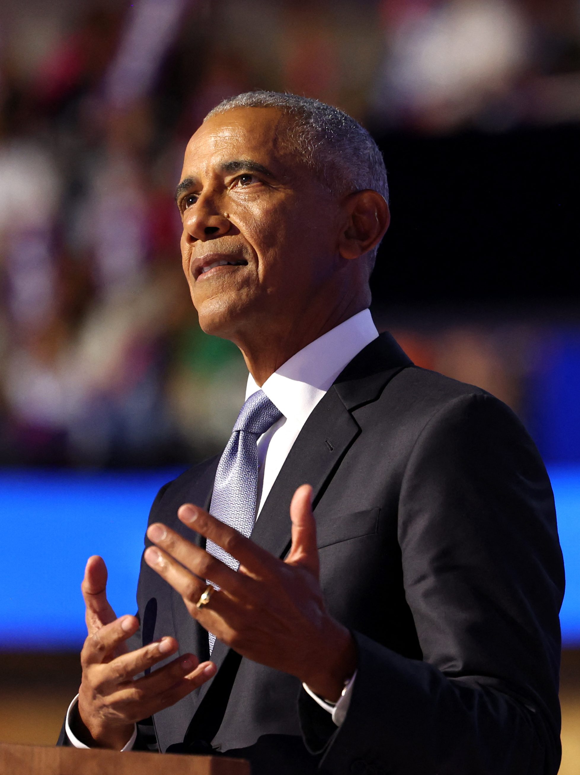 Barack Obama gestures as he speaks on the second day of the Democratic National Convention