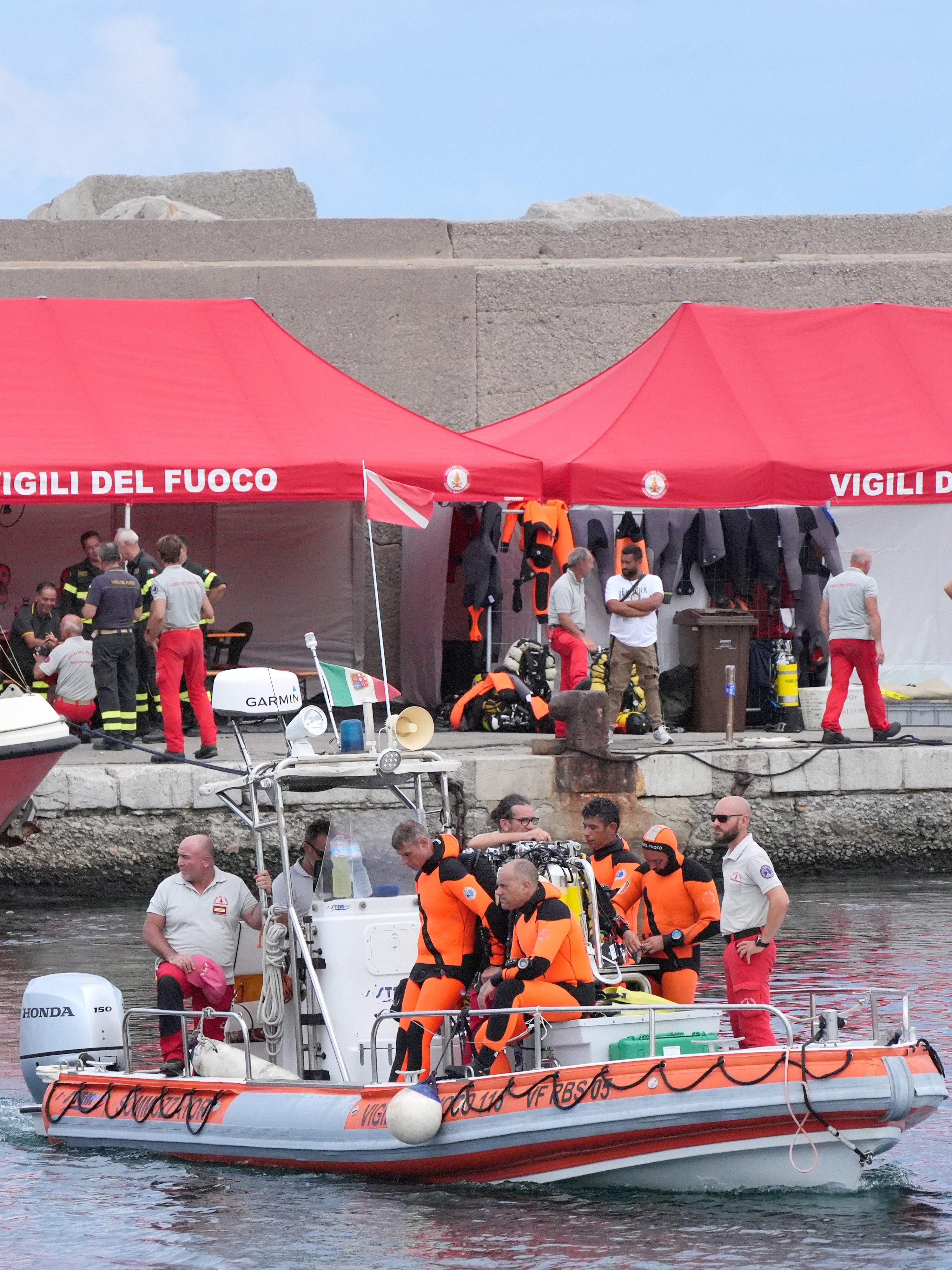 The fire service dive team leaves port heading for the dive site for the Bayesian off the coast of Porticello, Sicily, on the third day of the search for six tourists missing after the luxury yacht Bayesian sank in a storm on Monday whilst moored around half a mile off the coast. The Italian Coastguard has not ruled out the possibility that those missing may still be alive, with experts speculating air pockets could have formed as the yacht sank. Picture date: Wednesday August 21, 2024. (Photo by Jonathan Brady/PA Images via Getty Images)