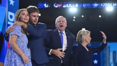 Tim Walz stands with wife Gwen, and children Gus and Hope