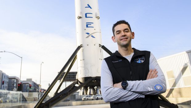 Inspiration4 mission commander Jared Isaacman, founder and chief executive officer of Shift4 Payments, stands for a portrait in front of the recovered first stage of a Falcon 9 rocket at Space Exploration Technologies Corp. (SpaceX) on February 2, 2021 in Hawthorne, California. - Isaacman's all-civilian Inspiration4 mission will raise $200 million for St. Jude Children's Research Hospital through a donation based sweepstakes to select a member of the crew. (Photo by Patrick T. FALLON / AFP) (Photo by PATRICK T. FALLON/AFP via Getty Images)