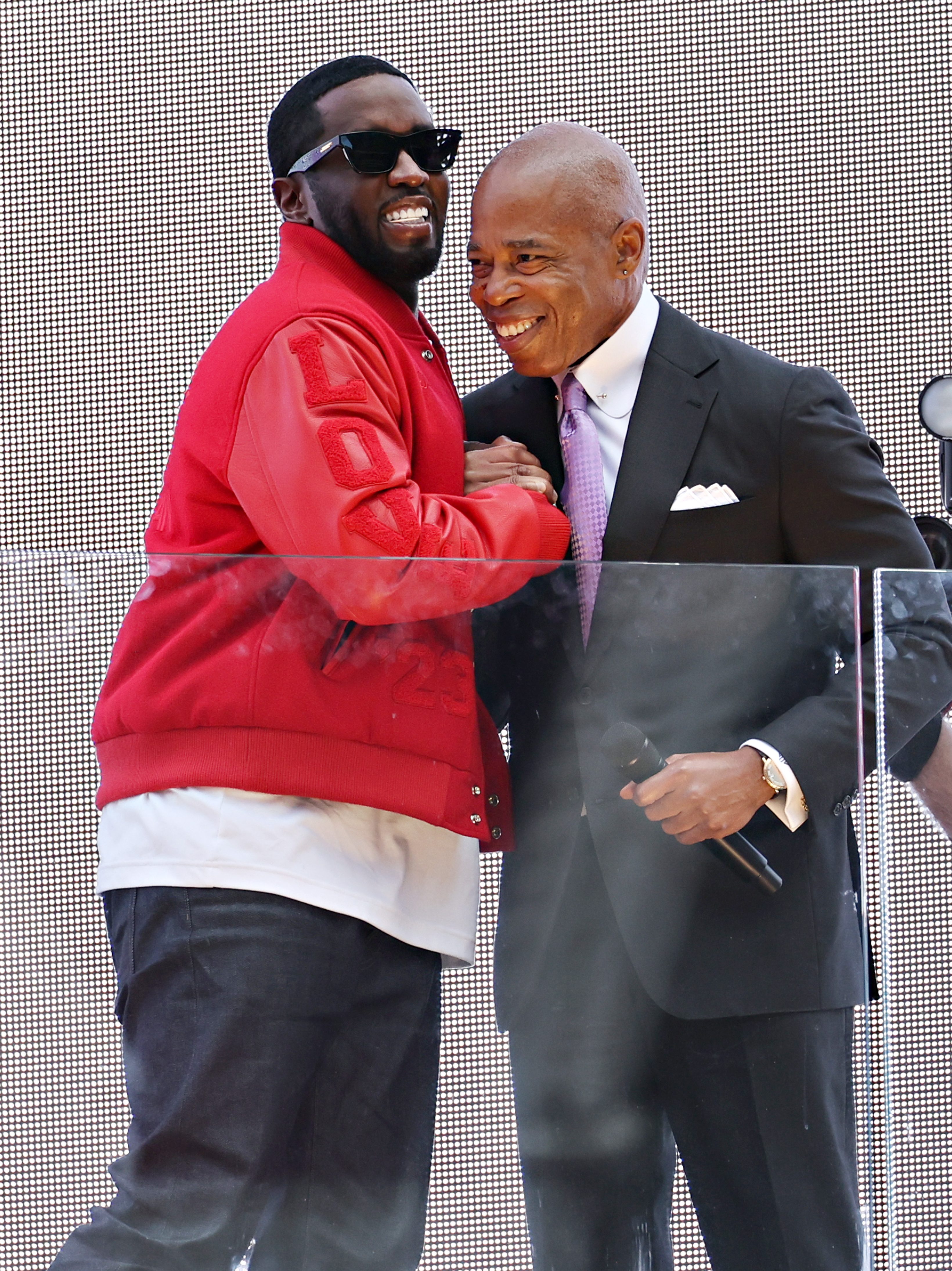 NEW YORK, NEW YORK - SEPTEMBER 15: New York Mayor Eric Adams (R) presents Sean "Diddy" Combs with the keys to the city in Times Square on September 15, 2023 in New York City. (Photo by Cindy Ord/Getty Images)