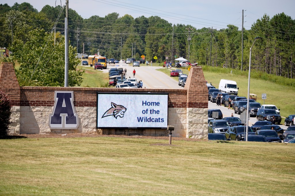 WINDER, GEORGIA - SEPTEMBER 4: Cars line the road as parents arrive to meet students after a shooting at Apalachee High School on September 4, 2024 in Winder, Georgia. Multiple fatalities and injuries have been reported and a suspect is in custody according to authorities. (Photo by Megan Varner/Getty Images)