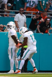 MIAMI GARDENS, FLORIDA - SEPTEMBER 08: Tyreek Hill #10 of the Miami Dolphins and Jaylen Waddle #17 of the Miami Dolphins celebrate after Hill's receiving touchdown during the third quarter against the Jacksonville Jaguars at Hard Rock Stadium on September 08, 2024 in Miami Gardens, Florida. (Photo by Megan Briggs/Getty Images)