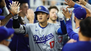 MIAMI, FLORIDA - SEPTEMBER 17: Shohei Ohtani #17 of the Los Angeles Dodgers celebrates with teammates after hitting a two-run home run against the Miami Marlins during the third inning at loanDepot park on September 17, 2024 in Miami, Florida. (Photo by Sam Navarro/Getty Images)