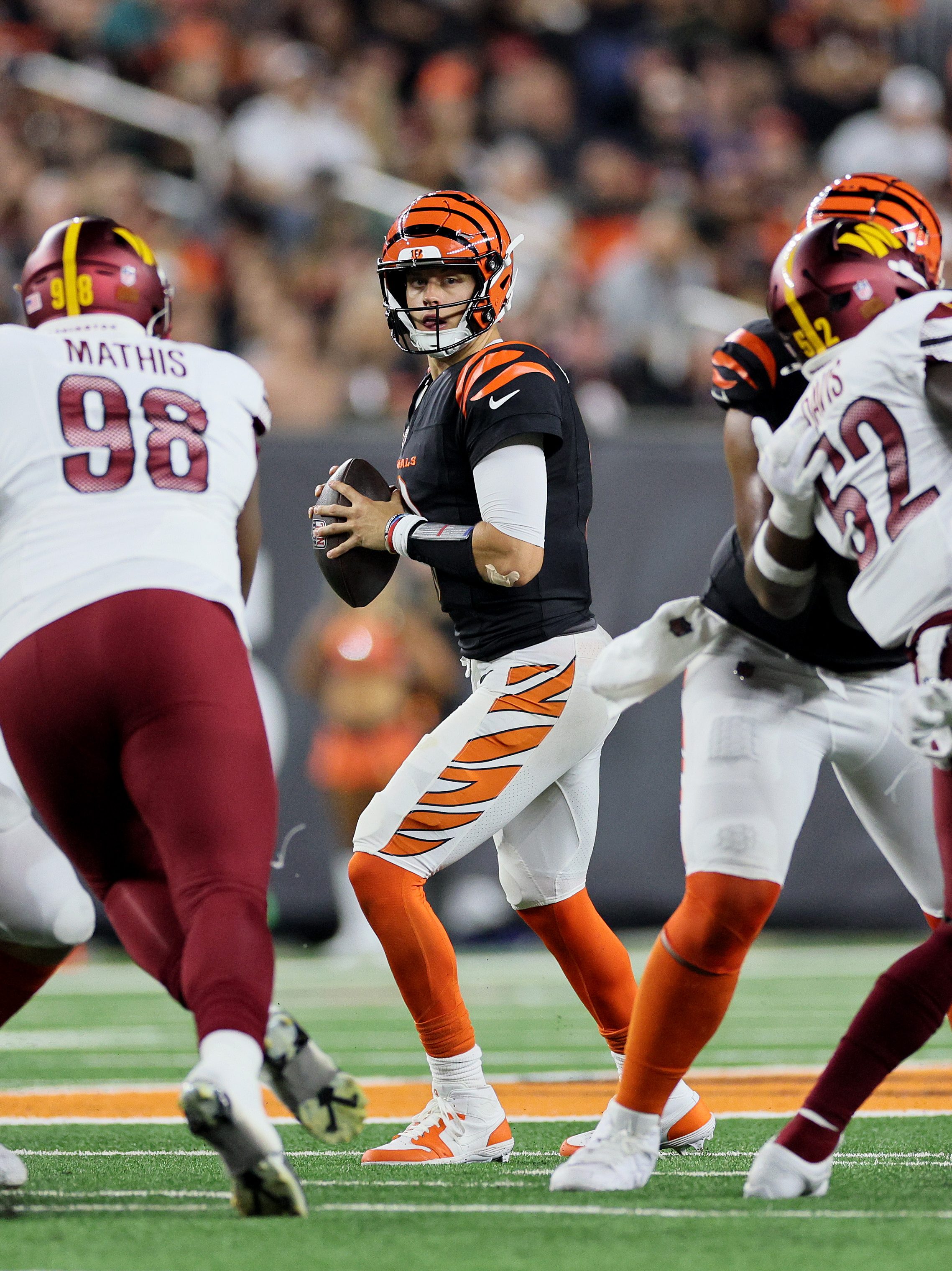 CINCINNATI, OHIO - SEPTEMBER 23: Joe Burrow #9 of the Cincinnati Bengals looks to pass against the Washington Commanders during the third quarter at Paycor Stadium on September 23, 2024 in Cincinnati, Ohio. (Photo by Andy Lyons/Getty Images)