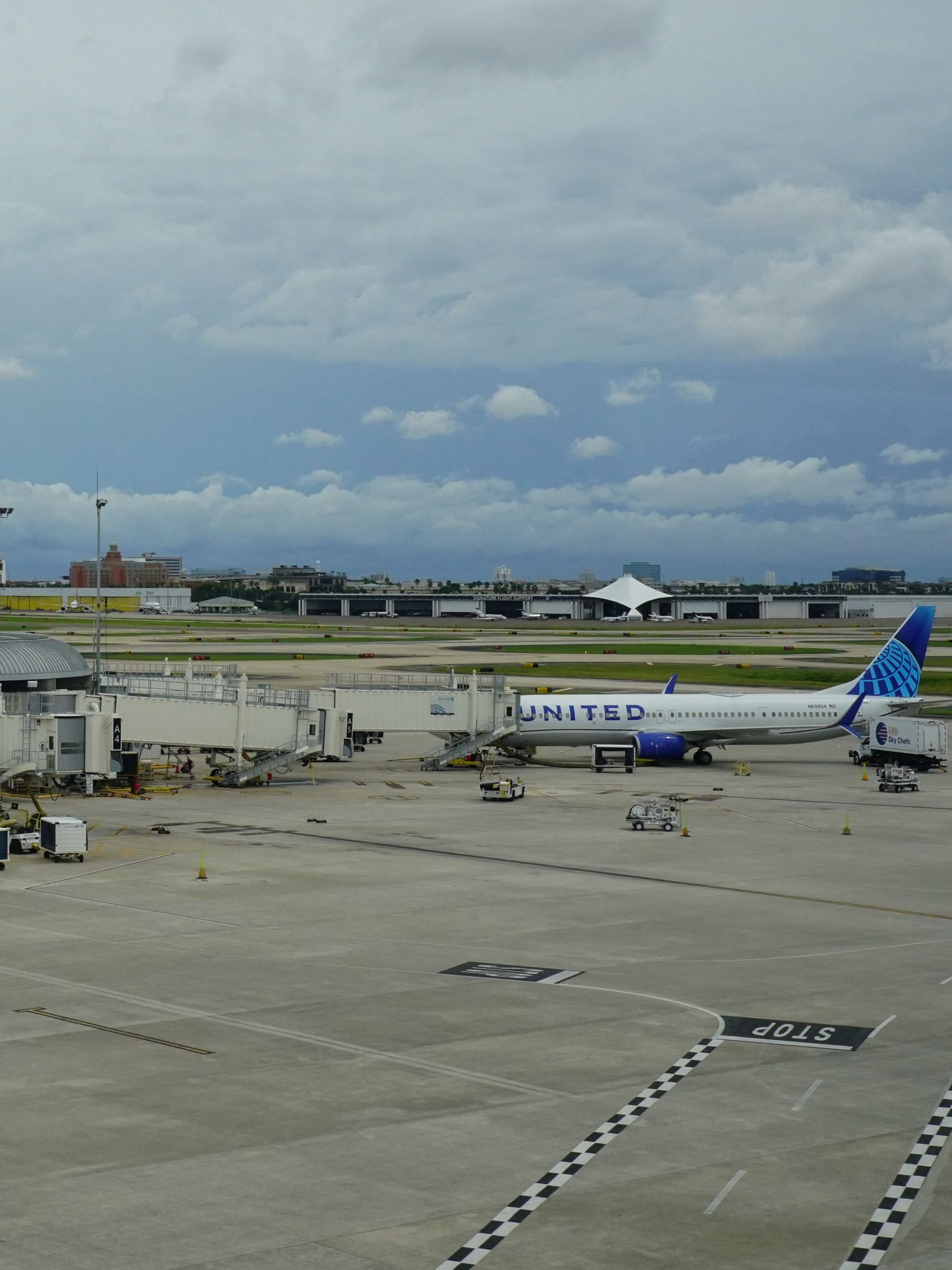 Planes are parked at Tampa International Airport before the airport is due to close at 17h00EDT (21h00GMT) ahead of Hurricane Ian on September 27, 2022 in Tampa, Florida. - The US National Hurricane Center (NHC) said Ian made landfall just southwest of the town of La Coloma, Cuba, at about 4:30 am local time (0830 GMT). The hurricane was packing maximum sustained winds of 125 miles (205 kilometers) per hour, the NHC said, making it a Category 3 storm on the Saffir-Simpson scale. (Photo by Bryan R. Smith / AFP) (Photo by BRYAN R. SMITH/AFP via Getty Images)
