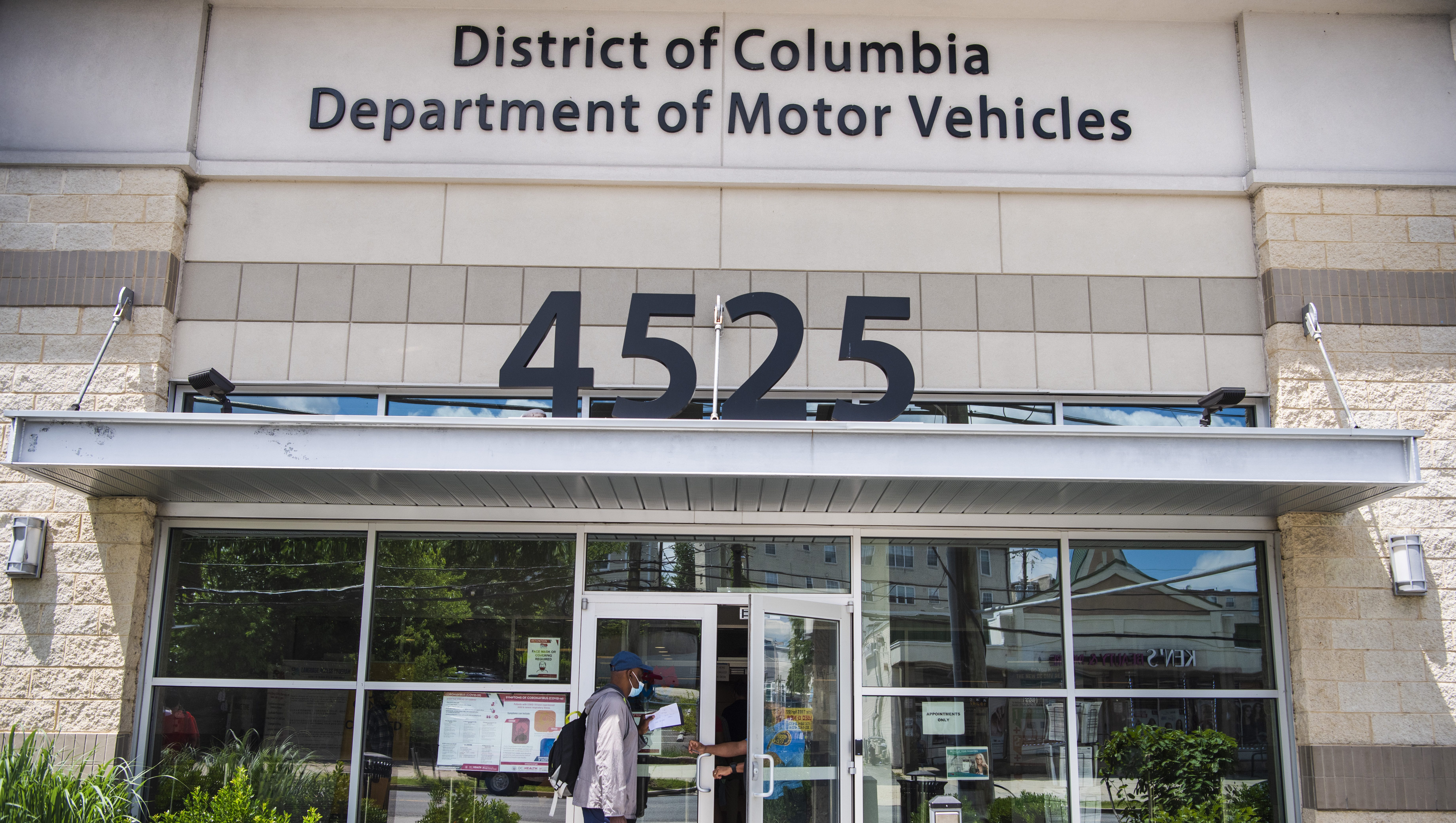 WASHINGTON, D.C. - JUNE 24: Garry Scott, 68, makes a stop at the Department of Motor Vehicles Benning Ridge Service Center to request information and turn in old license plates on Thursday, June 24, 2021 in Washington, D.C. Mr. Scott made an appointment at the the DMV location weeks prior to renew his license after Mayor Muriel Bowser announced a four-month amnesty program for drivers. However, when he arrived he was frustrated to find that the program was aimed to give an opportunity to pay outstanding tickets with the penalties waived but the original fines still remained.  "I came back to get information and badge info to file an incident report with special police regarding a previous incident during a scheduled appointment on the 15th," said Scott of an issue that resulted with security personnel during his appointment. (Photo by Amanda Voisard/for The Washington Post via Getty Images)