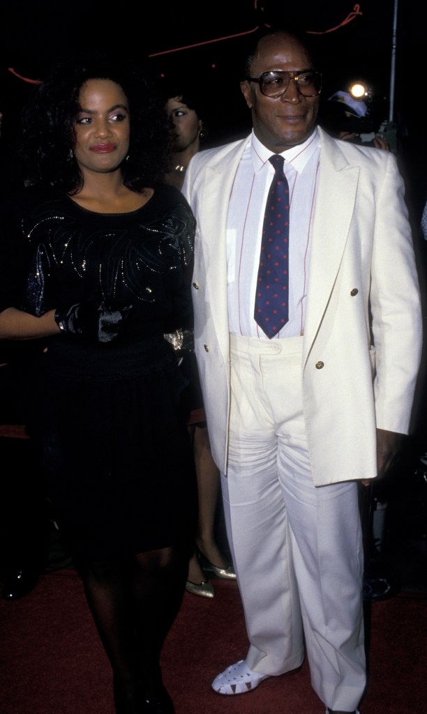 HOLLYWOOD, CA - JUNE 26:  John Amos and daughter Shannon Amos attend the premiere of "Coming To America" on June 26, 1988 at Mann Chinese Theater in Hollywood, California. (Photo by Ron Galella, Ltd./Ron Galella Collection via Getty Images)