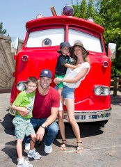 ANAHEIM, CA - JULY 02:  In this handout photo provided by Disney Parks, Tom Brady, his son Jack, 5, Gisele Bundchen, and their son Benjamin, 3, pose with Red the Fire Truck at Cars Land at Disney California Adventure park July 2, 2013 in Anaheim, California.  The 12-acre Cars Land immerses guests in the thrilling world of the Disney-Pixar blockbuster "Cars" film franchise as they step into the town of Radiator Springs.  (Photo by Paul Hiffmeyer/Disneyland Resort via Getty Images)