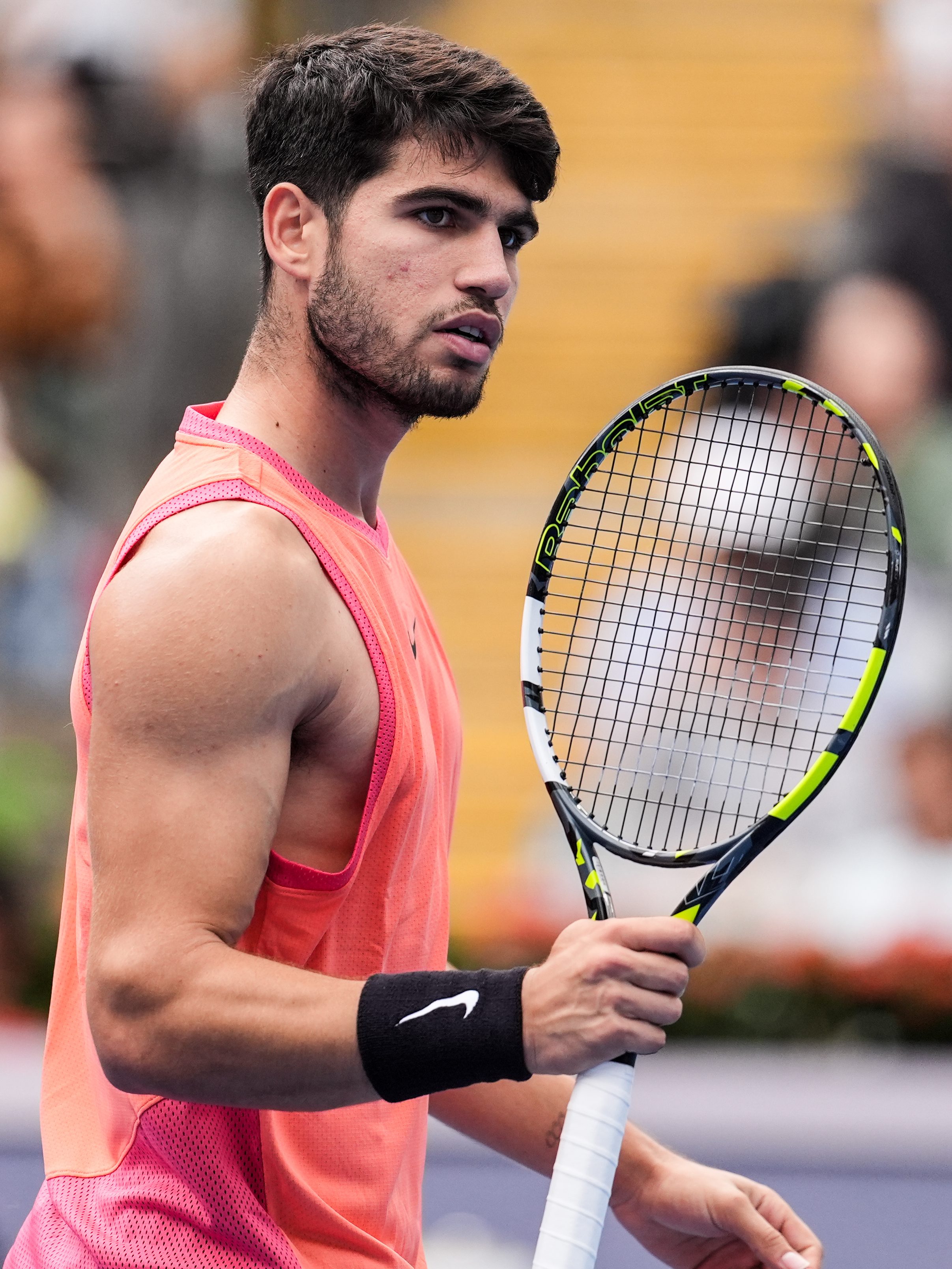 BEIJING, CHINA - SEPTEMBER 27: Carlos Alcaraz of Spain reacts in the Men's Singles First Round against Giovanni Mpetshi Perricard  of France during day five of the 2024 China Open at National Tennis Center on September 27, 2024 in Beijing, China. (Photo by Shi Tang/Getty Images)