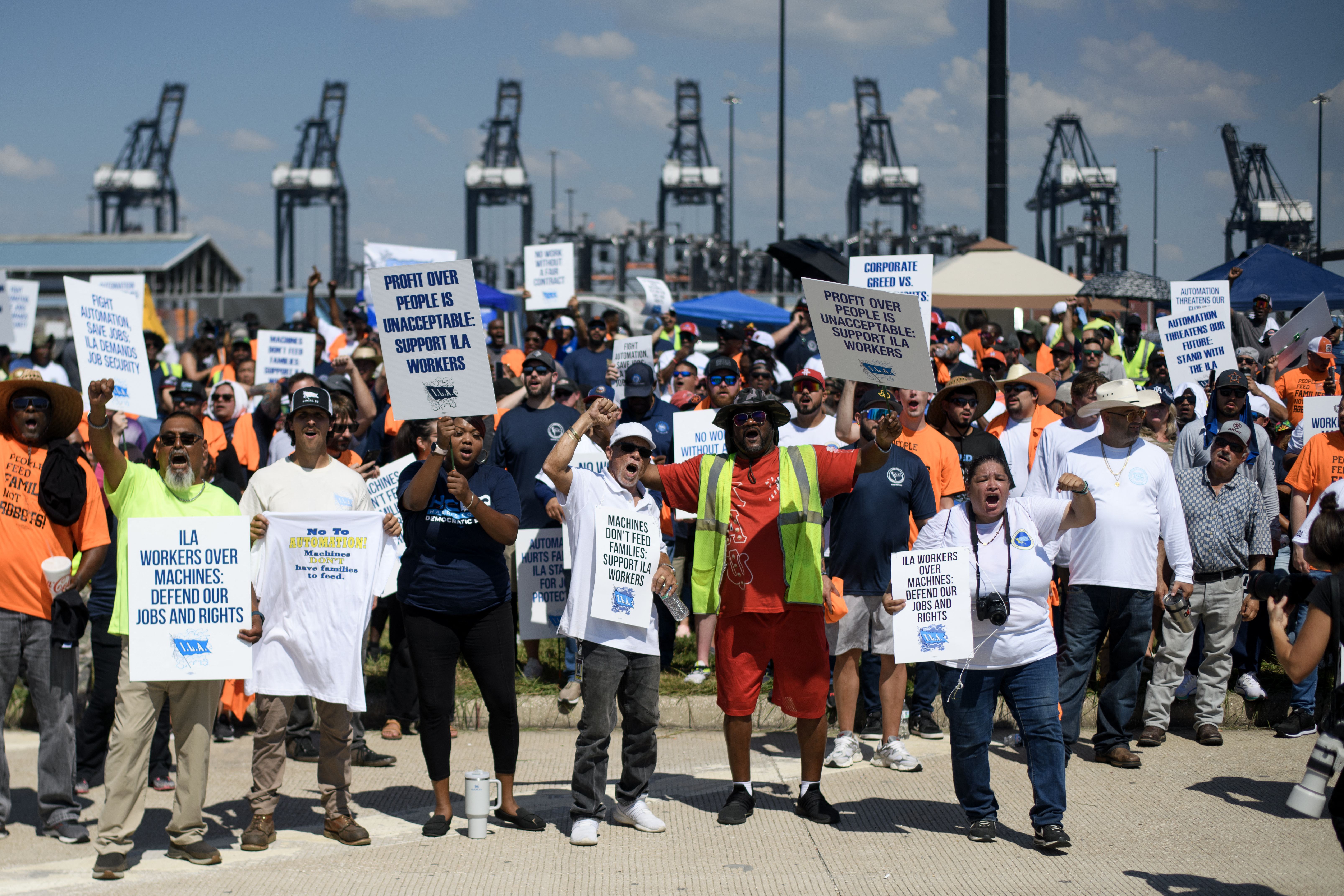 TOPSHOT - Dockworkers gather at the Bayport Container Terminal in Seabrook, Texas, on October 1, 2024. Officials at 14 ports along the US East and Gulf Coasts were making last-minute preparations on September 30 for a likely labor strike that could drag on the US economy just ahead of a presidential election -- despite last-minute talks. (Photo by Mark Felix / AFP) (Photo by MARK FELIX/AFP via Getty Images)