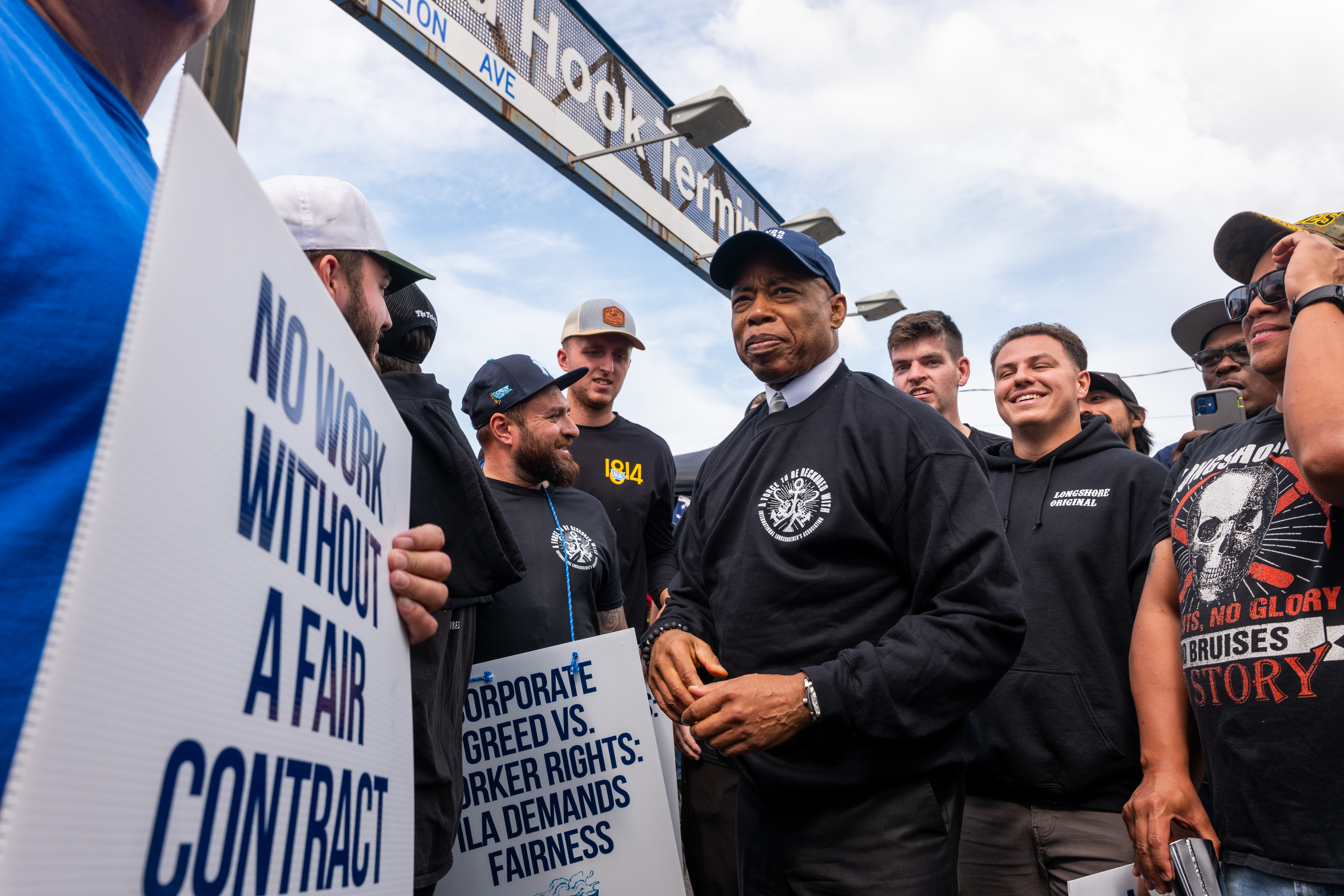 NEW YORK, NEW YORK - OCTOBER 01: New York City Mayor Eric Adams visits striking workers at the Red Hook Container Terminal in Brooklyn after members of the International Longshoremen’s Association, or ILA, began walking off the job after 12:01 a.m. ET on October 01, 2024 in New York City. The strike of over 50,000 workers at ports along the East Coast and Texas comes after the contract between the ILA and the United States Maritime Alliance, or USMX expired. Workers are striking over wages, use of automated technology and other issues. (Photo by Spencer Platt/Getty Images)