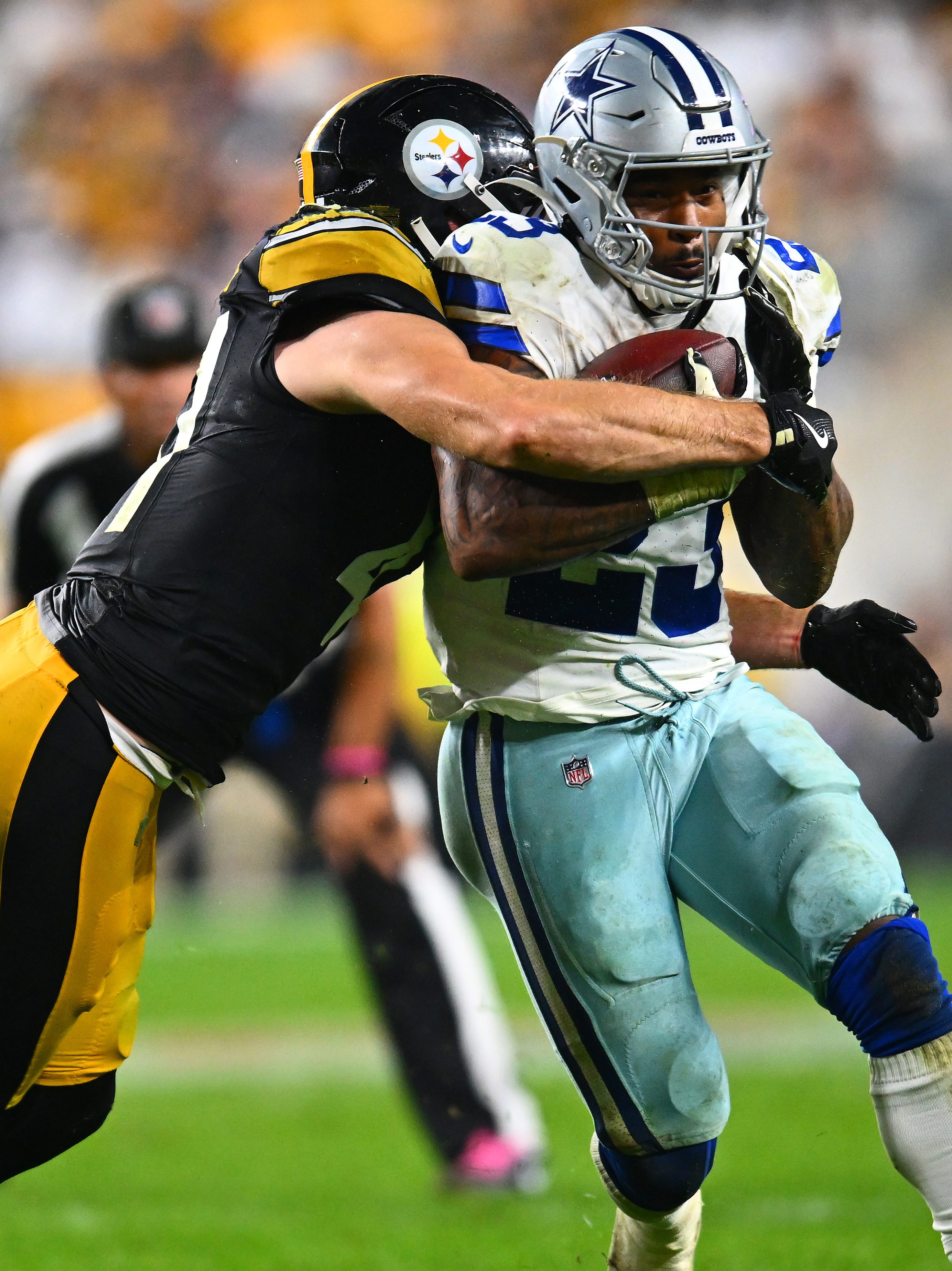 PITTSBURGH, PENNSYLVANIA - OCTOBER 06: Rico Dowdle #23 of the Dallas Cowboys is tackled by Payton Wilson #41 of the Pittsburgh Steelers during the fourth quarter at Acrisure Stadium on October 06, 2024 in Pittsburgh, Pennsylvania. (Photo by Joe Sargent/Getty Images)