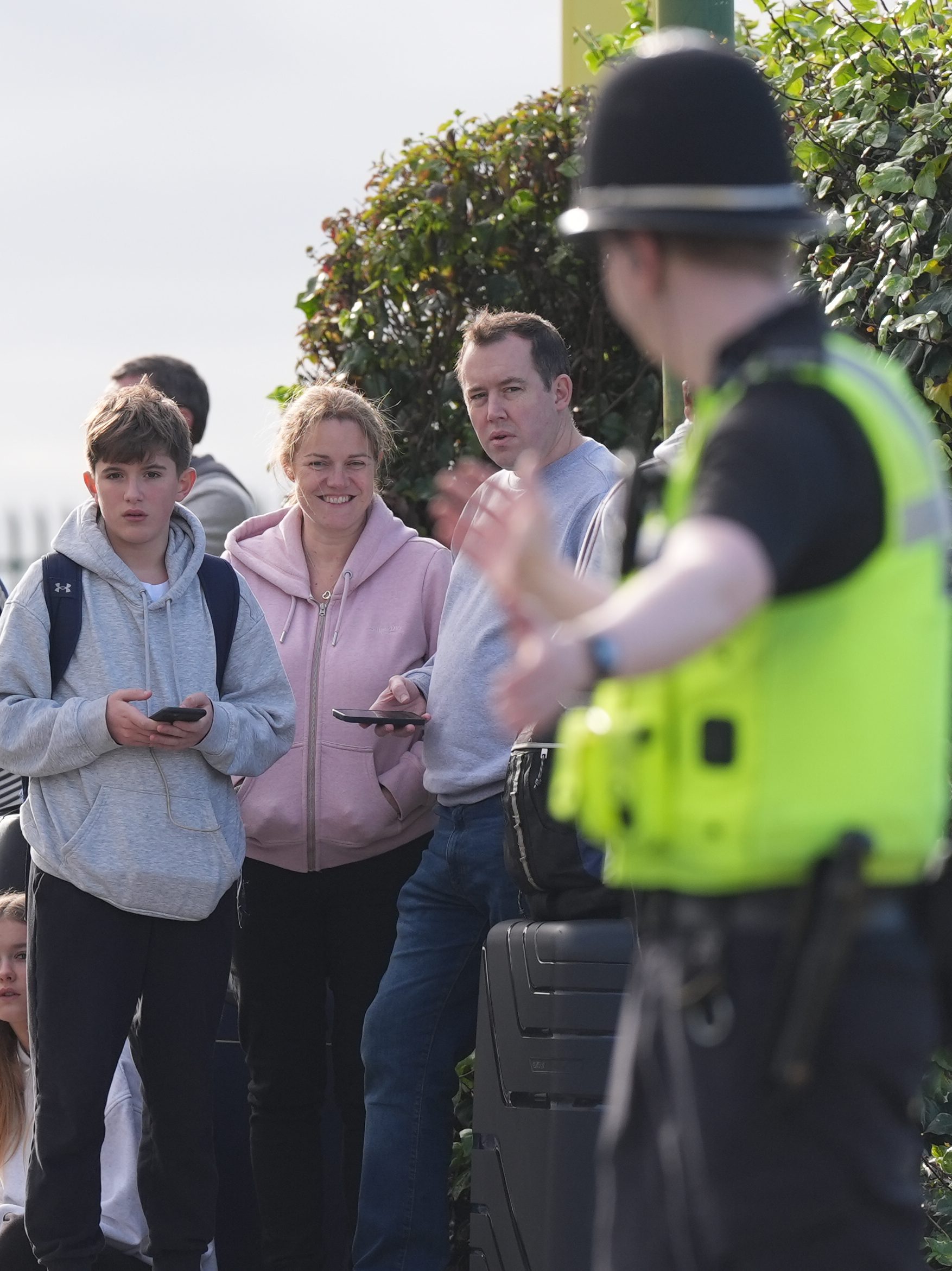 Passengers wait to enter Birmingham Airport after it was evacuated following a security alert. Picture date: Wednesday October 23, 2024. (Photo by Jacob King/PA Images via Getty Images)
