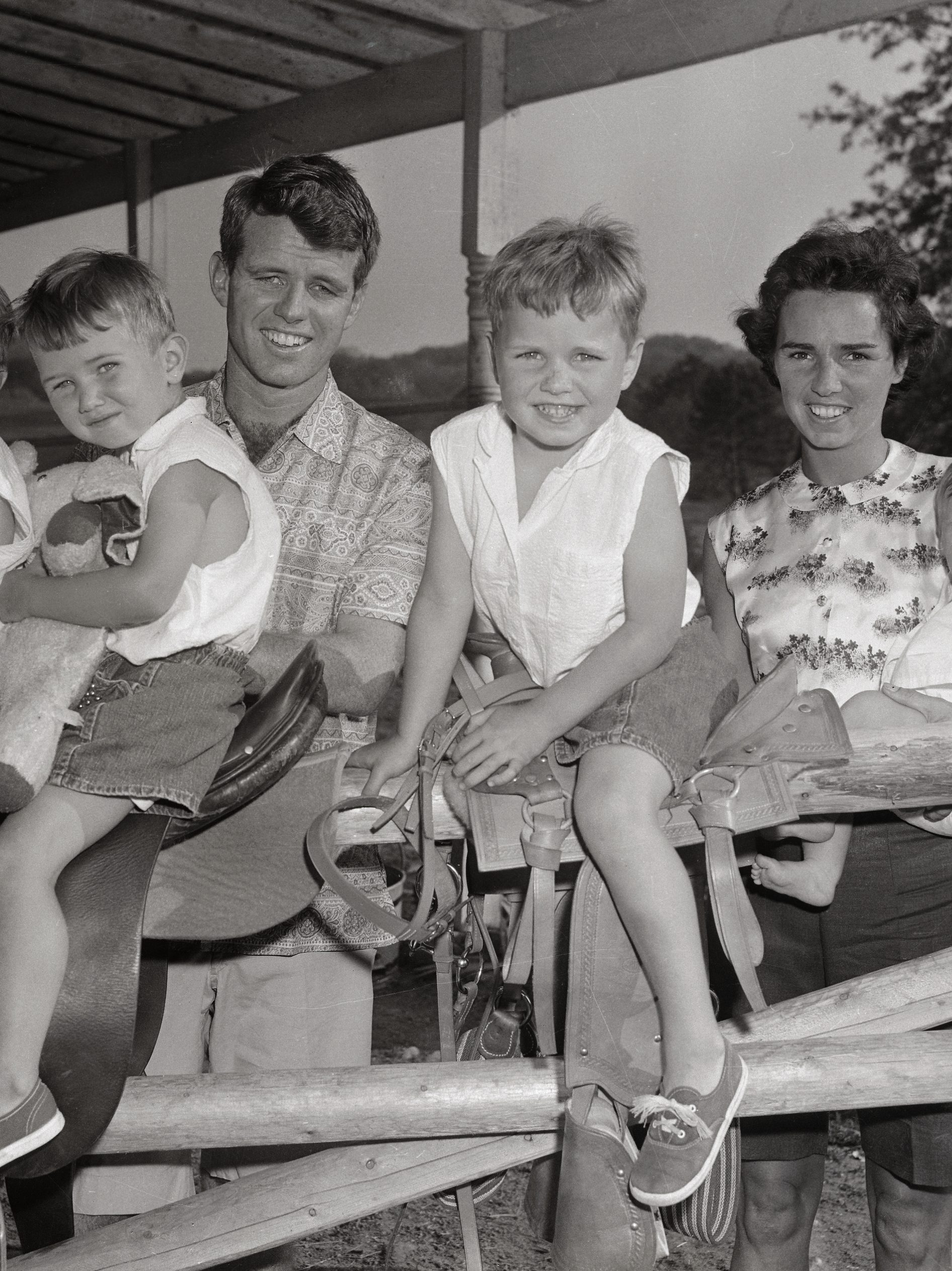 (Original Caption) Robert Kennedy, now a Senate Committee investigator, is shown with his wife, Ethel, and four of their five children. The children, from left, are: David Anthony, 1 1/2; Robert Francis, 3; Joseph Pat, 4 and Mary Courtney, 7 months. Kathleen, 5, is not shown in the photo which was taken at Kennedy's McLean, Virginia home.