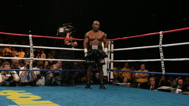 Former heavyweight champion Mike Tyson waits in the "neutral corner" after inflecting a ruled intentional head-butt against opponent Kevin McBride of Ireland, 11 June 2005 at the MCI Center in Washington, DC, in a non-title bout.  McBride was declared winner when Tyson quit, sitting on his ring-corner-stool before the 7th round. Tyson announced his retirement after the fight.    AFP PHOTO/Paul J. RICHARDS (Photo credit should read PAUL J. RICHARDS/AFP via Getty Images)