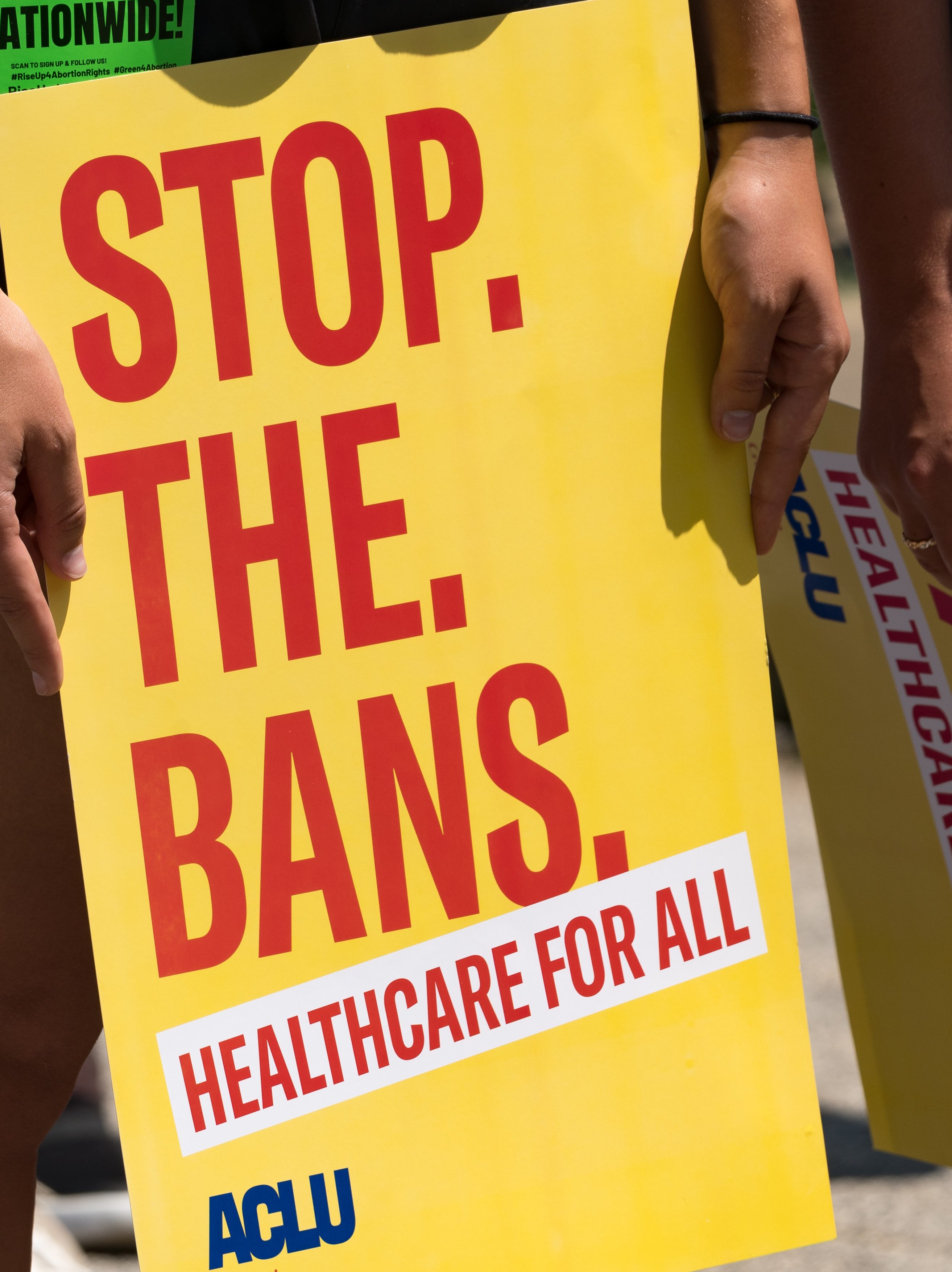 ATLANTA, GA - JULY 23: A protester holds a sign while marching and chanting through Downtown Atlanta, in opposition to Georgia's new abortion law on July 23, 2022 in Atlanta, Georgia. A federal appeals court has decided to allow a Georgia law that bans abortion after six weeks of pregnancy to go into effect.  Previously Georgia law allowed abortions up to 20 weeks of pregnancy.  (Photo by Megan Varner/Getty Images)