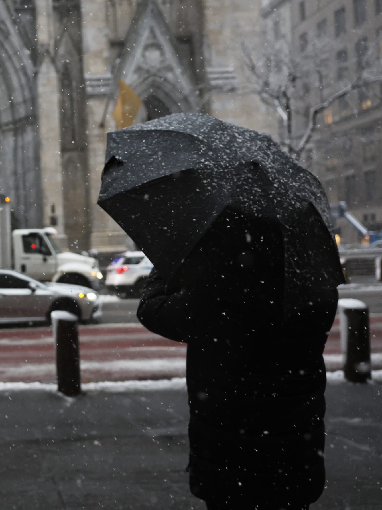 NEW YORK, NEW YORK - FEBRUARY 13: Snow is seen covering the umbrellas of people taking pictures at Rockefeller Center amid a winter storm on February 13, 2024 in New York City. The biggest winter storm in two years is hitting the Northeast with NYC forecasted to get three to five inches of snow. In anticipation of the storm, Mayor Eric Adams announced that schools would be going fully remote today. (Photo by Michael M. Santiago/Getty Images)