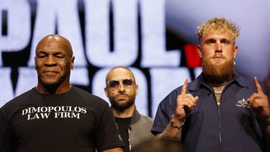 NEW YORK, NEW YORK - MAY 13: (L-R) Mike Tyson and Jake Paul speak onstage at the press conference in promotion for the upcoming Jake Paul vs. Mike Tyson boxing match at The Apollo Theater on May 13, 2024 in New York City. (Photo by Sarah Stier/Getty Images for Netflix)