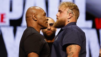 NEW YORK, NEW YORK - MAY 13: (L-R) Mike Tyson and Jake Paul speak onstage at the press conference in promotion for the upcoming Jake Paul vs. Mike Tyson boxing match at The Apollo Theater on May 13, 2024 in New York City. (Photo by Sarah Stier/Getty Images for Netflix)