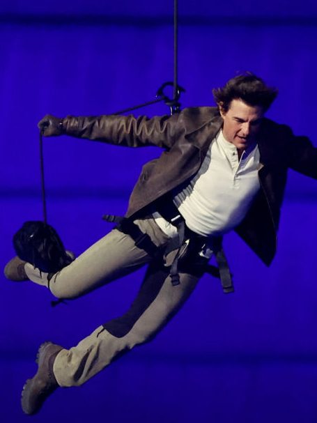 PARIS, FRANCE - AUGUST 11: Actor Tom Cruise jumps from the roof of the Stade de France during the Closing Ceremony of the Olympic Games Paris 2024  at Stade de France on August 11, 2024 in Paris, France. (Photo by Fabrizio Bensch- Pool/Getty Images)