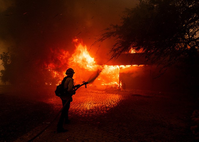 A Firefighter Tended to a Burning House