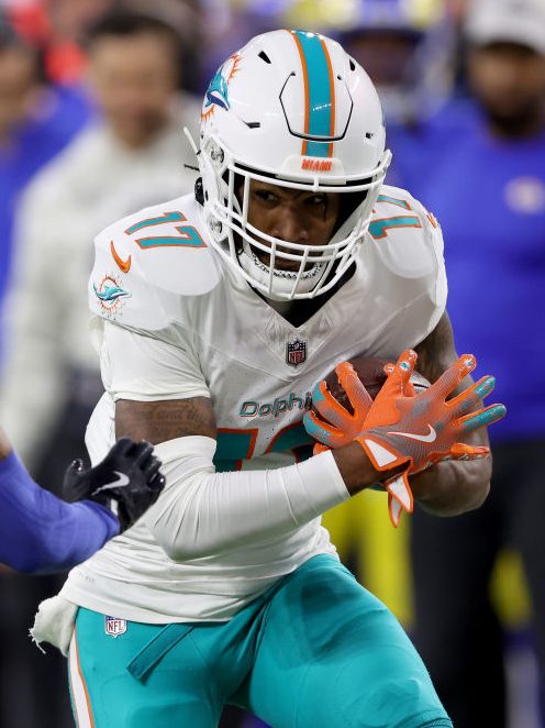 INGLEWOOD, CALIFORNIA - NOVEMBER 11: Jaylen Waddle #17 of the Miami Dolphins runs with ball against Cobie Durant #14 of the Los Angeles Rams during the first quarter in the game at SoFi Stadium on November 11, 2024 in Inglewood, California. (Photo by Sean M. Haffey/Getty Images)