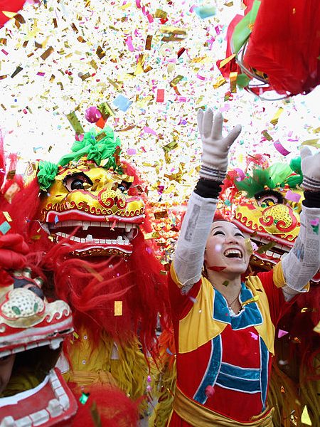 BEIJING, CHINA - JANUARY 22:   Chinese folk artists perform the lion dance at a temple fair to celebrate the Lunar New Year of Dragon on January 22, 2012 in Beijing, China. Falling on January 23 this year, the Chinese Lunar New Year, also known as the Spring Festival, which is based on the Lunisolar Chinese calendar, is celebrated from the first day of the first month of the lunar year and ends with Lantern Festival on the Fifteenth day.  (Photo by Feng Li/Getty Images)