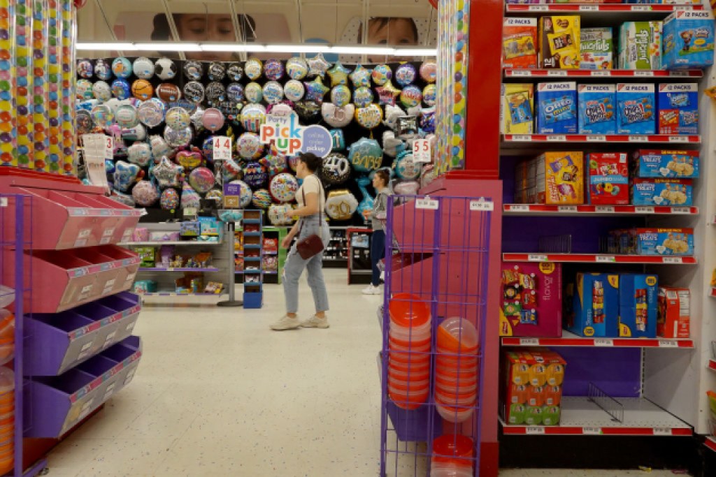 MIAMI, FLORIDA - JANUARY 18: People shop in a Party City store on January 18, 2023 in Miami, Florida. Party City Holdco Inc. filed for Chapter 11 bankruptcy protection in a bid to restructure its heavy debt load after supply chain problems, rising inflation and a consumer slowdown have hurt sales. (Photo by Joe Raedle/Getty Images)