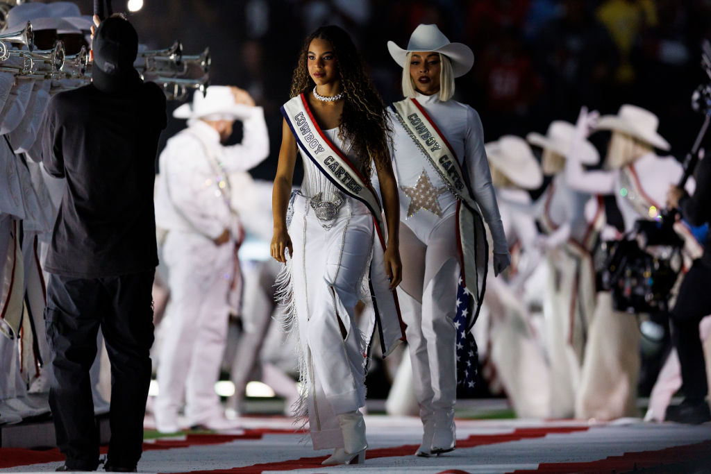 HOUSTON, TEXAS - DECEMBER 25: Blue Ivy walks onto the field for the Beyoncé halftime show during an NFL football game between the Baltimore Ravens and the Houston Texans, at NRG Stadium on December 25, 2024 in Houston, Texas. (Photo by Brooke Sutton/Getty Images)