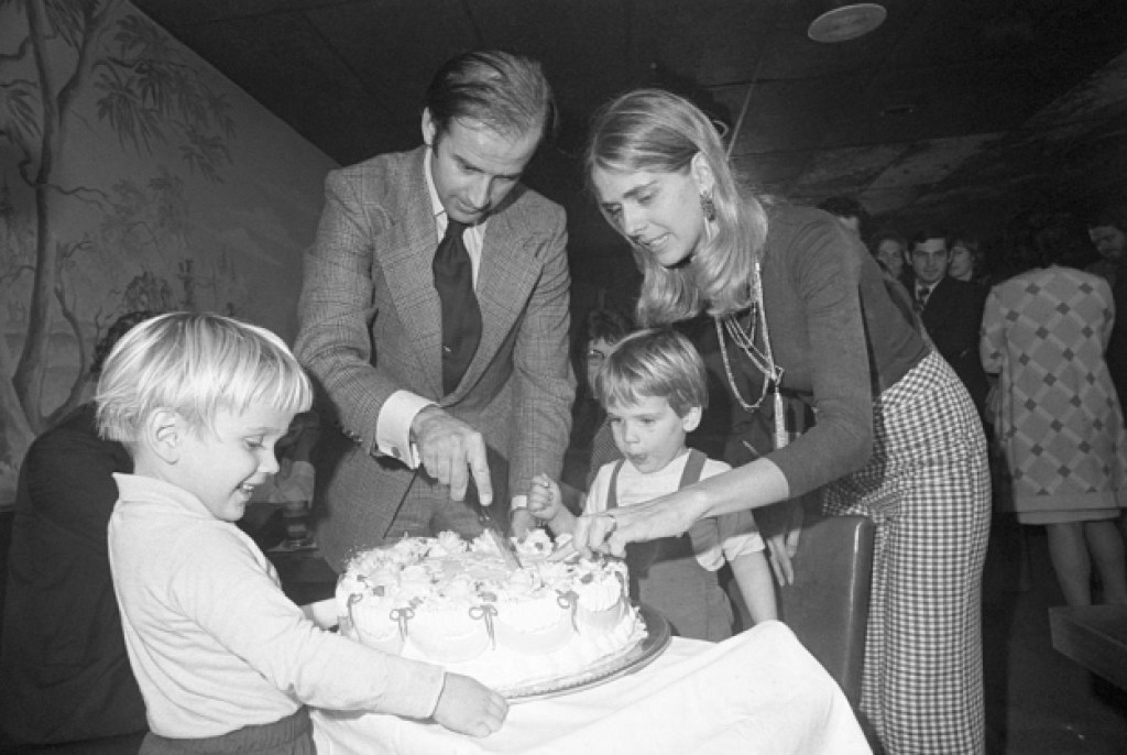 Senator-elect Joseph Biden and wife Nelia cut his 30th birthday cake at a party in Wilmington, November 20th. His son, Hunter waits for the first piece. Biden by becoming 30 fulfills the constitutional requirement of Senators being 30 years of age when they take office.