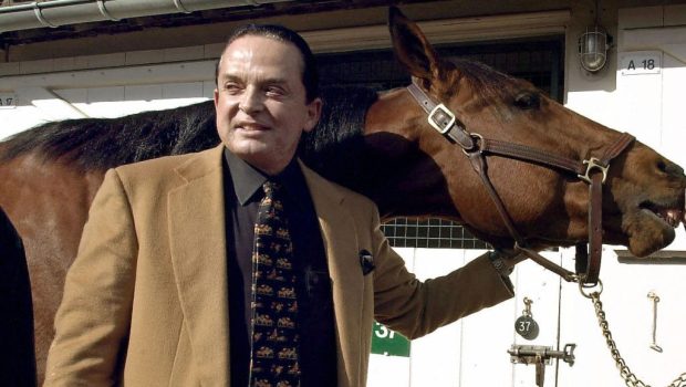 A photo taken 07 March 2002 in Deauville, western France, shows art dealer and horse owner Alec Wildenstein (L) posing with his horse Kesaco Phedo, winner of the three-year Criterium and of the Prix de Vincennes. Alec Wildenstein died 18 February 2008 in Paris.   AFP PHOTO MYCHELE DANIAU (Photo credit should read MYCHELE DANIAU/AFP via Getty Images)